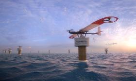 Modello di un parco eolico in mezzo al mare in cui ci sono dei droni giganti su delle piattaforme galleggianti.