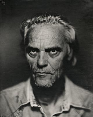 Black and white photographic portrait of a man