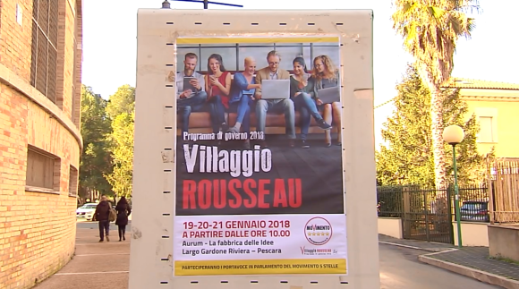 La locandina del Villaggio Rousseau (raduno di attivisti e candidati 5 Stelle) fuori dal centro Aurum di Pescara