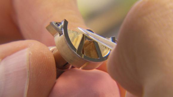 Close up of watch part made by hand