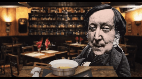 La figura di Rossini montata (stile collage) davanti al tavolo di un osteria, dove si appresta a consumare un omelette