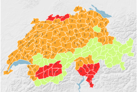Cartina della Svizzera divisa in piccole porzioni di territorio, colorate di giallo o arancione o rosso
