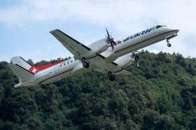 Un aereo di Adria Airways in volo partito da Lugano Agno.