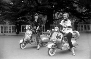 Competition of motor elegance: Vespas. Paris, bois de Boulogne, in June 1951.